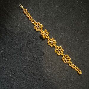 Elegant Gold and Purple Floral Bracelet